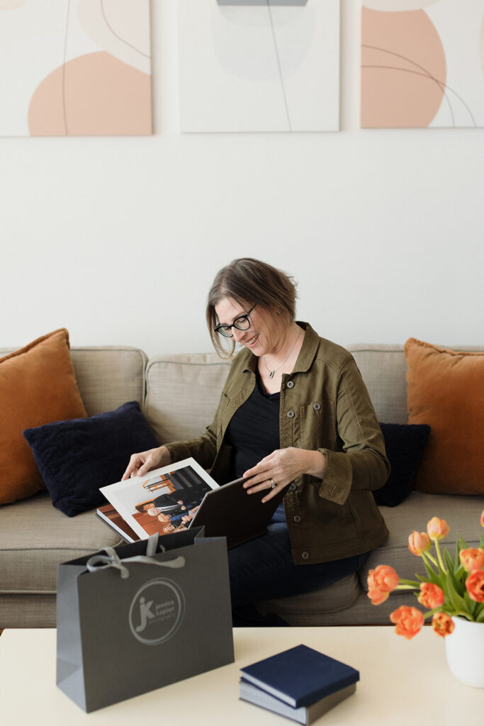 woman looking at photo album surviving a failed launch Chicago brand mini sessions