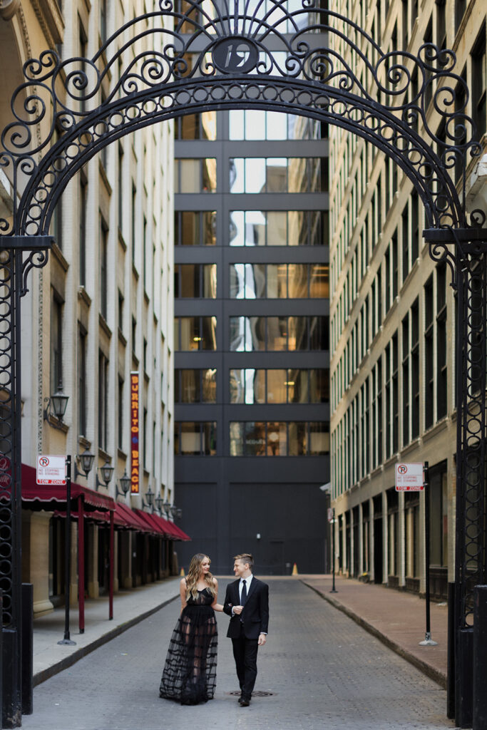 couple walking in Financial District Chicago Romantic River North engagement session