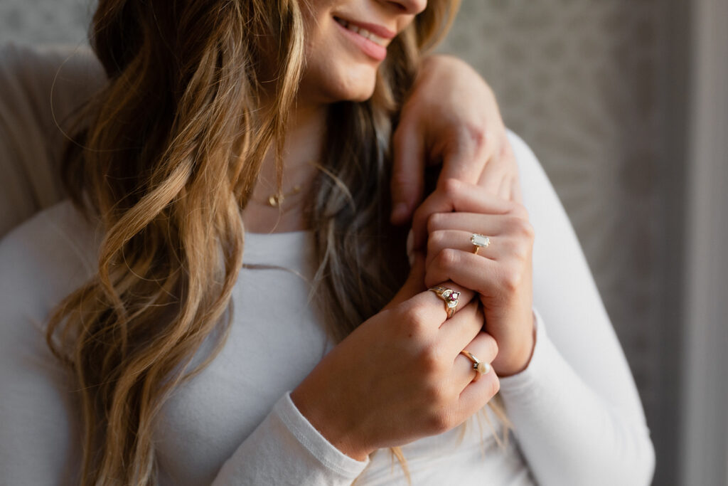 close up shot of rings on woman's fingers romantic engagement session