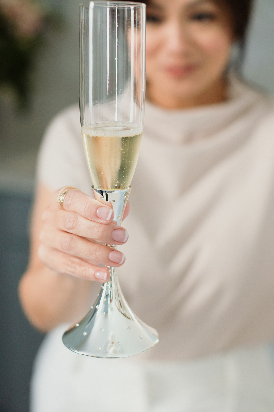 woman toasting with champagne brand photos