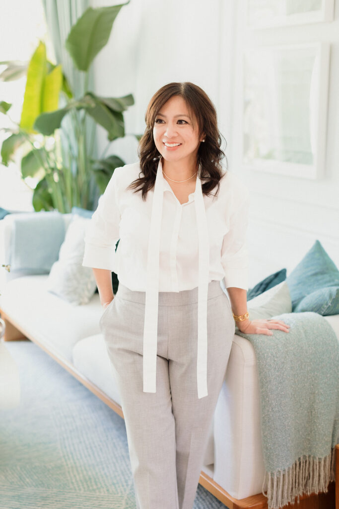 What to Wear for Your Brand Shoot calligrapher, woman leaning casually against a couch with greenery, Chicago brand photography