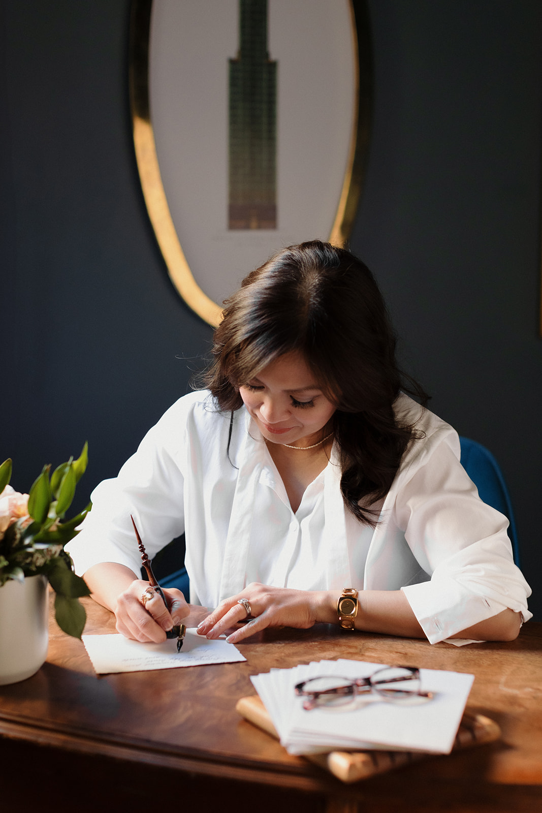 What to Wear for Your Brand Shoot calligrapher, woman writing calligraphy at a vintage desk Chicago brand photos