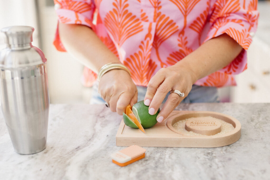 Megan of Bridie Travel making margaritas during a fun, personality-driven brand photography session in studio