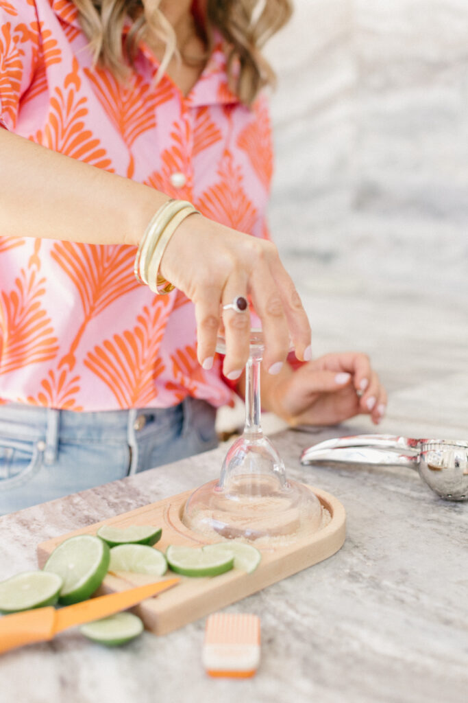 Luxury travel planner making margaritas during a fun, personality-driven brand photography session in Chicago studio
