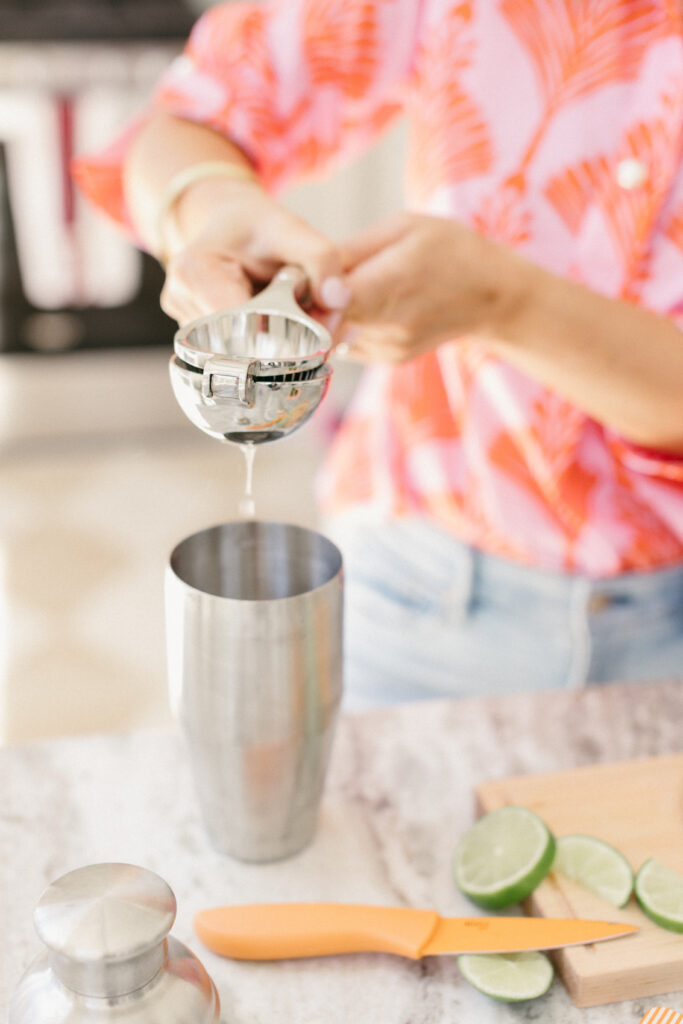 Luxury travel planner making margaritas during a fun, personality-driven brand photography session in Chicago studio