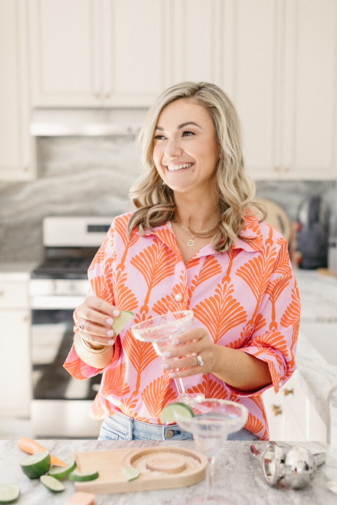 Luxury travel planner making margaritas during a fun, personality-driven brand photography session in Chicago studio
