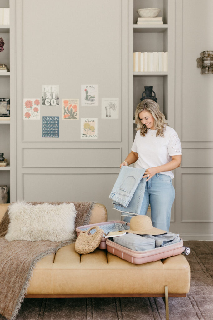 Destination wedding travel planner Megan packing for a trip, captured during brand photography session by Lisa Kathan