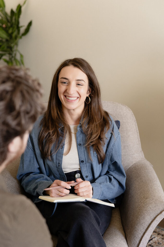 Therapist brand photos talking with client during a session