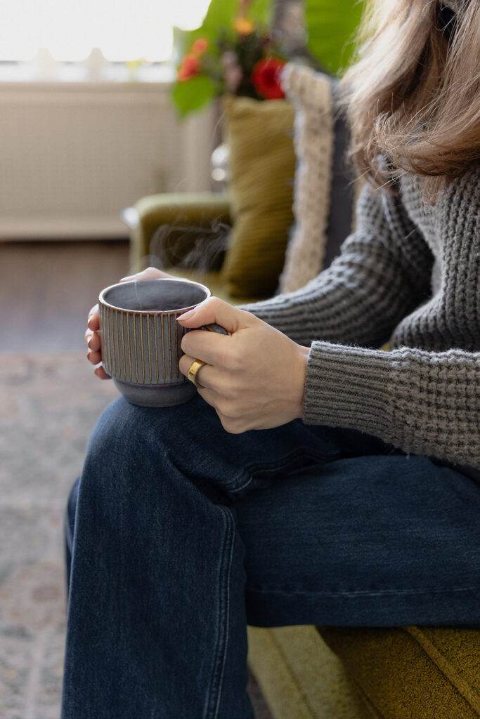 Therapist brand photos showing clients hands around a mug during a session