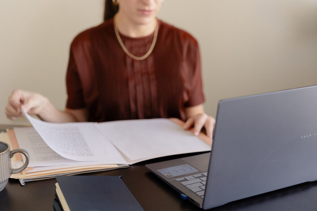 Brand photography for a Chicago therapist working on a laptop