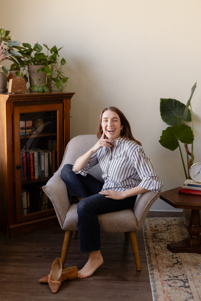 Candid laughing brand photo of a Chicago therapist in her practice